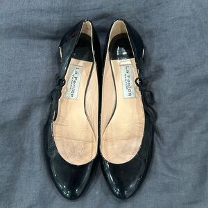 Patent leather flats with side cutout detail